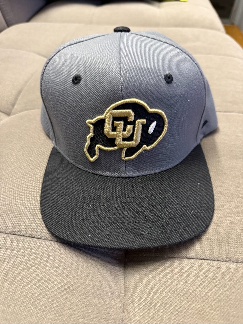 Zephyr Gray and Black Snapback Hat with Gold Embroidered Logo